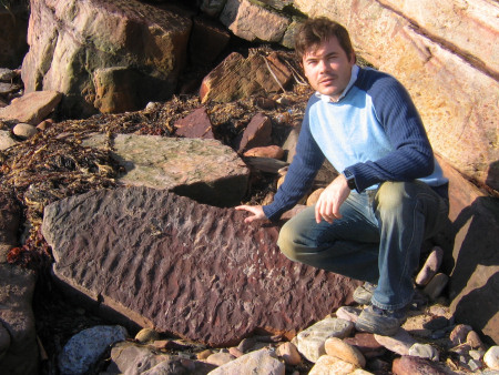 Roy Shepherd with prehistoric ripple marks at Crail