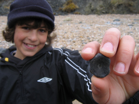 Isaac Verkaik with a fossil ichthyosaur vertebra from Lyme Regis