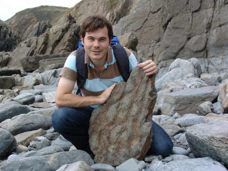 Roy Shepherd with a section of rock featuring prehistoric ripple marks